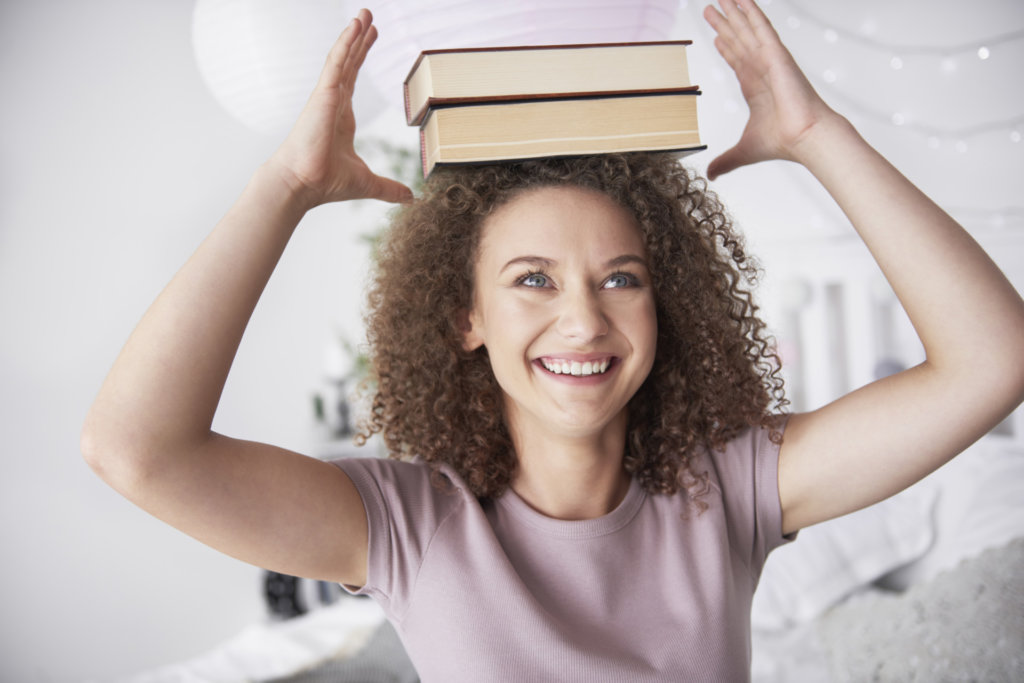 girl holding books