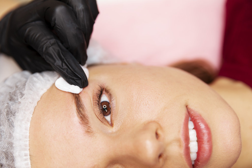 beautiful young woman going through microblading